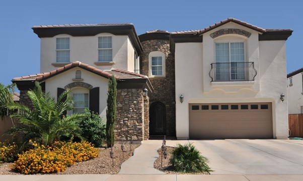 Property with a garage and balcony